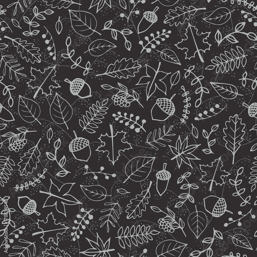 Vector hand drawn pattern with autumn elements contours: foliage, berries and acorns on the dark gray background. Maple, sycamore, birch, beech and oak tree leaves. Chalkboard imitation.