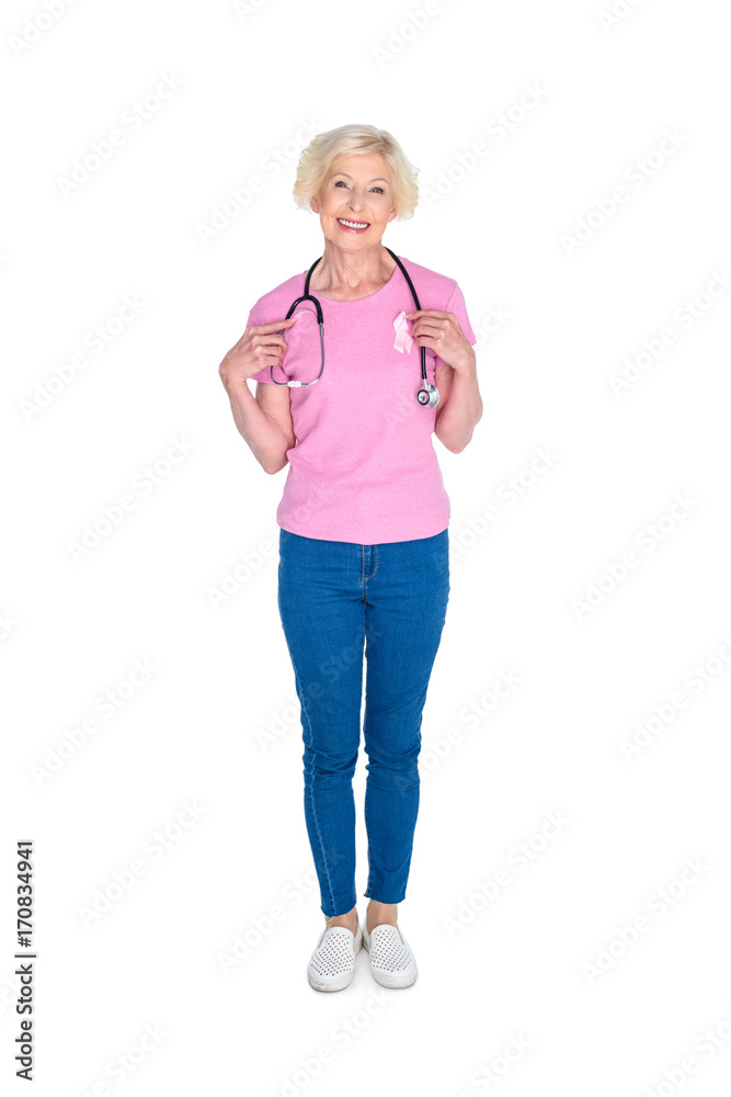senior woman with pink ribbon and stethoscope senior woman with pink ribbon and stethoscope