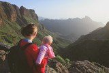 mother and little daughter travel in mountains