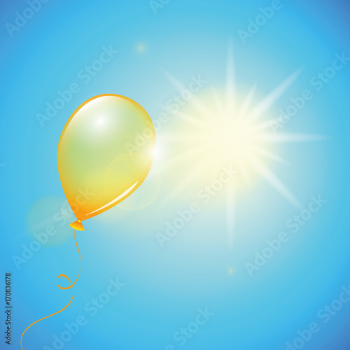 orangener luftballon fliegt richtung sonne