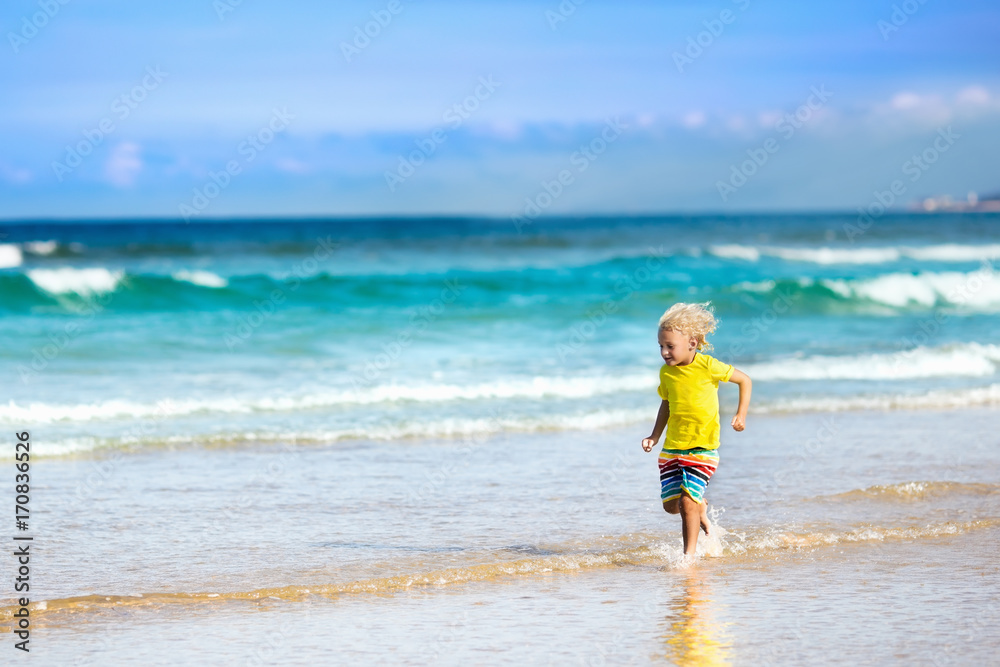Child on tropical beach. Sea vacation with kids. Child on tropical beach. Sea vacation with kids.
