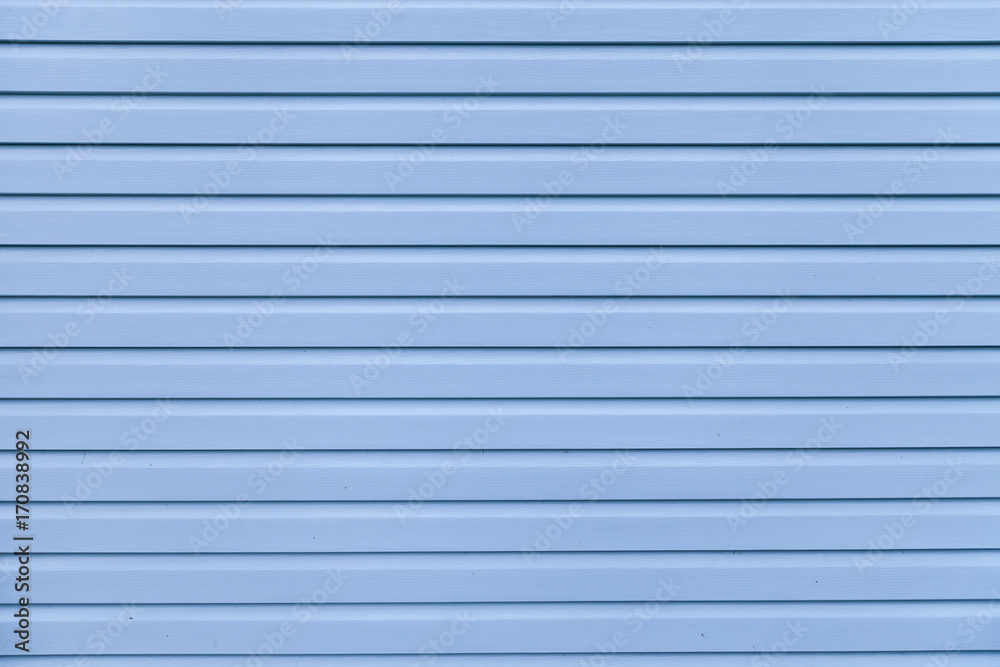 Blue vinyl wooden siding panel background with imitation wood texture
