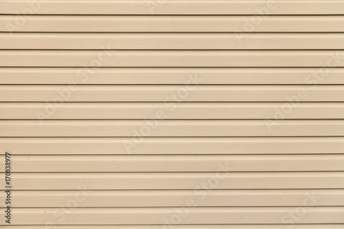 Wallpaper Mural Light brown (beige) vinyl wooden siding panel background with imitation wood texture