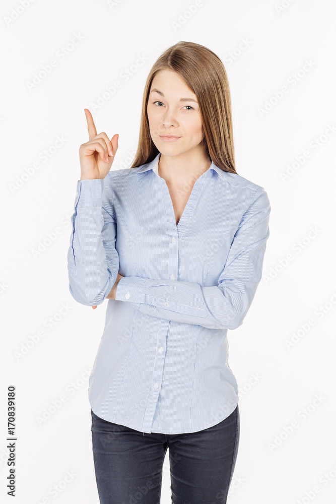 happy young lady pointing finger up and looking at the camera. Isolated over white background. happy young lady pointing finger up and looking at the camera. Isolated over white background.