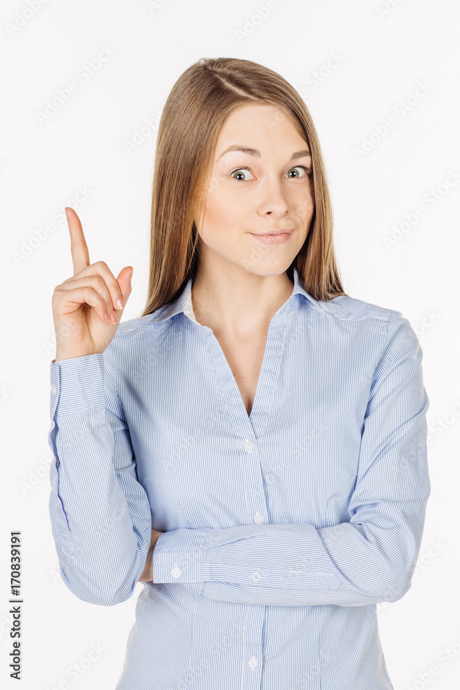 happy young lady pointing finger up and looking at the camera. Isolated over white background. happy young lady pointing finger up and looking at the camera. Isolated over white background.