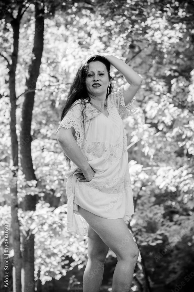 A mature active sinple woman from small town walks in the city park on a warm day and enjoys life. A lady without complexes feeling sexy and loves herself and her appearance A mature active sinple woman from small town walks in the city park on a warm day and enjoys life. A lady without complexes feeling sexy and loves herself and her appearance