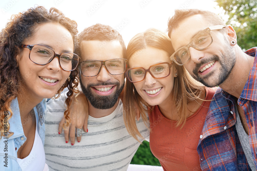Portrait of young adults with eyeglasses - obrazy, fototapety, plakaty 