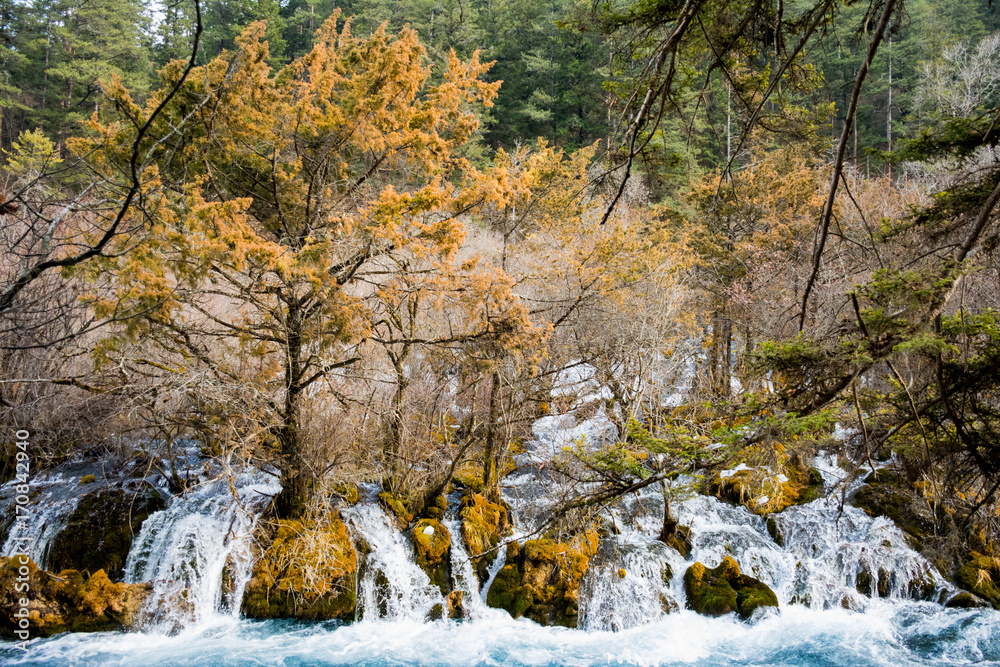 Waterfall on the rocks in the autumn time Waterfall on the rocks in the autumn time