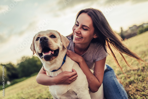 Young woman with dog photo