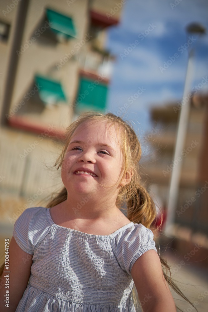 Very happy young girl playing outdoors. Very happy young girl playing outdoors.