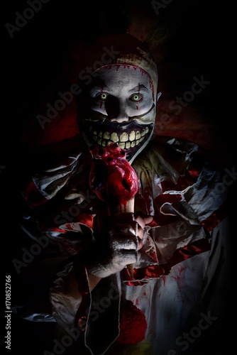 horror clown eating heart ice cream