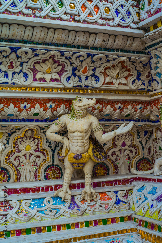 Traditional Thai style sculptures and painting of monster,animals and gods in church under decoration of Wat Pariwat
