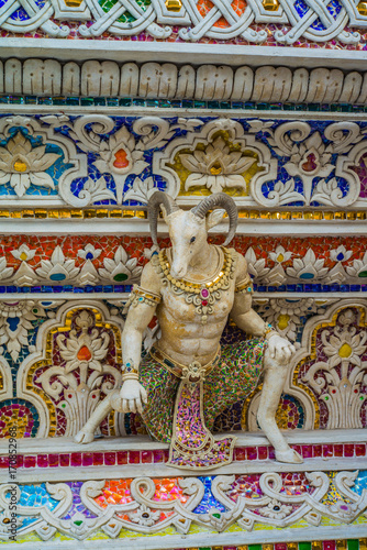 Traditional Thai style sculptures and painting of monster,animals and gods in church under decoration of Wat Pariwat