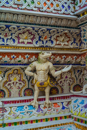 Traditional Thai style sculptures and painting of monster,animals and gods in church under decoration of Wat Pariwat © Thananithaporn