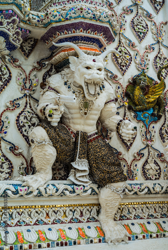 Traditional Thai style sculptures and painting of monster,animals and gods in church under decoration of Wat Pariwat