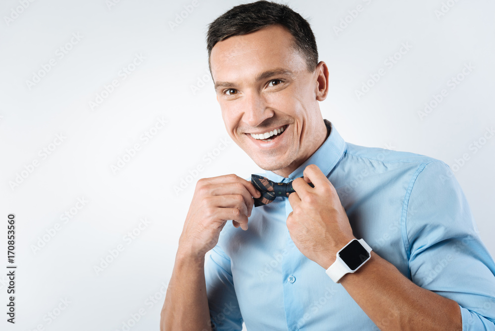 Cheerful positive man looking stylish Cheerful positive man looking stylish