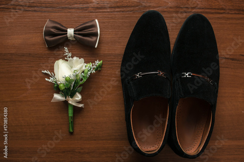 boutonniere,bow and groom's shoes