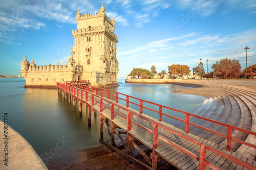 Belem Tower at low tide in the morning. Torre de Belem is Unesco Heritage and symbol of Lisbon, in Belem District on Tagus River. Belem Tower is the most visited tourist attraction in Lisbon, Portugal photo