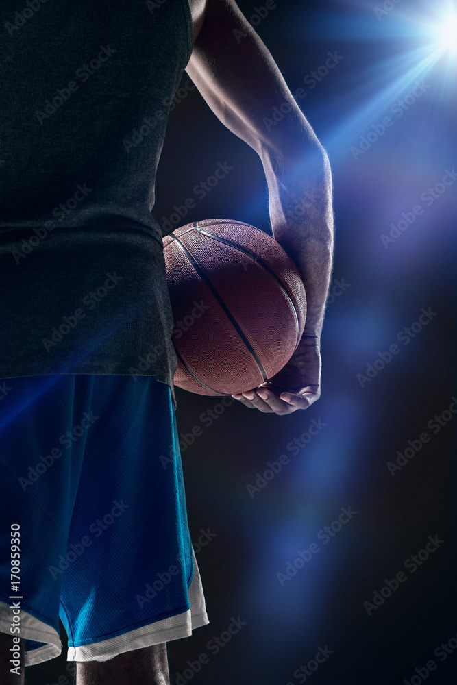 Naklejka premium The portrait of a basketball player with ball