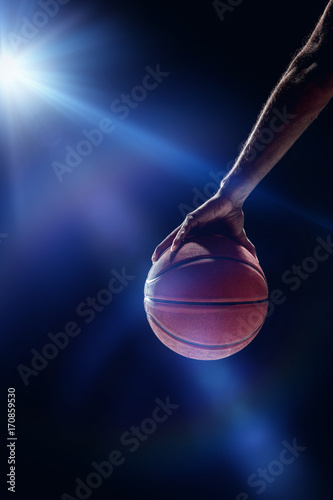 The portrait of a basketball player with ball