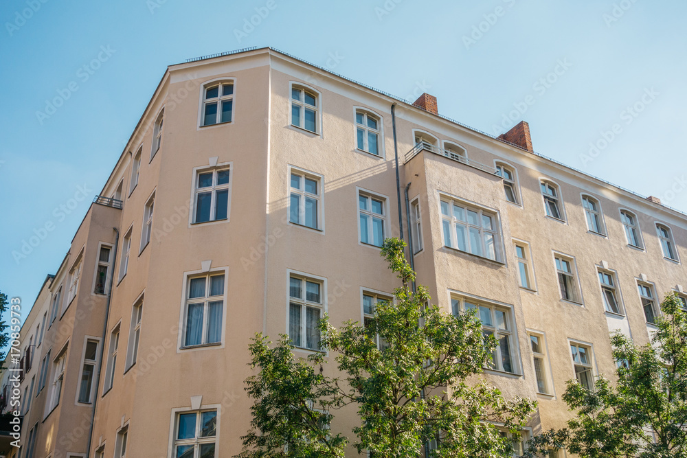 Fototapeta premium orange colored building on clean background