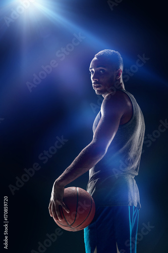 The portrait of a basketball player with ball © master1305