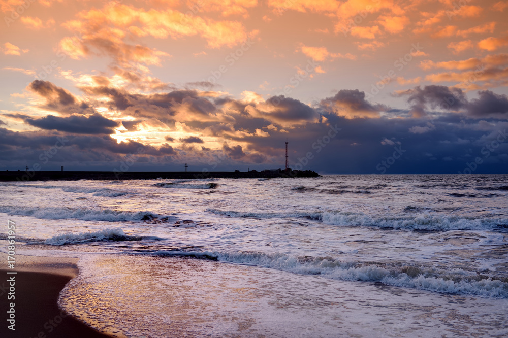 Dramatic sunset over the Baltic sea at winter.