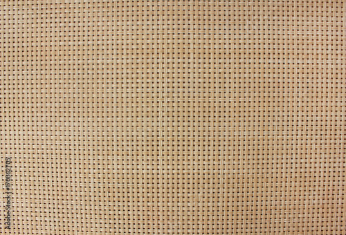 Light brown wood plank texture background. Antique bamboo weave pattern wallpaper with small squares. Empty detailed boarded frame structure close up. Natural material with blank copy space top view 