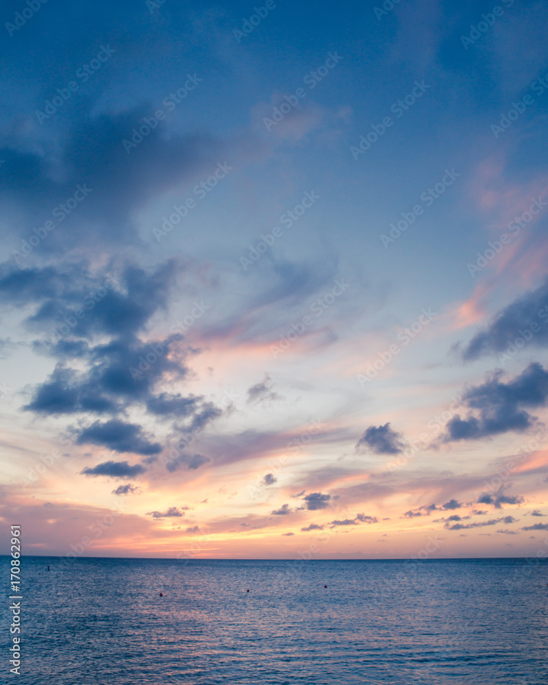 Fototapeta premium Beautiful beach scene with sea and sunset sky