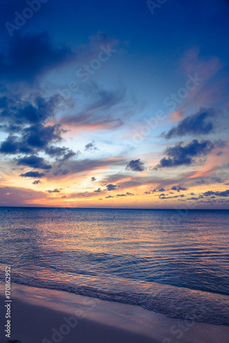 Fototapeta Naklejka Na Ścianę i Meble -  Beautiful beach scene with  sea and sunset sky