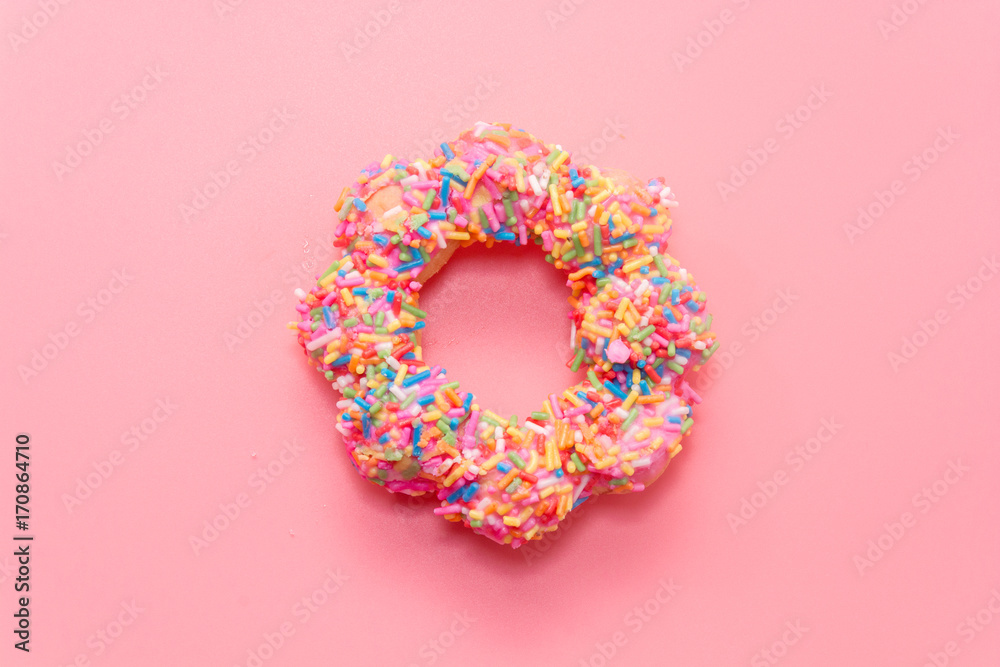 colorful doughnut on pink background colorful doughnut on pink background