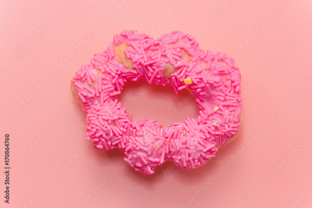 colorful doughnut on pink background colorful doughnut on pink background