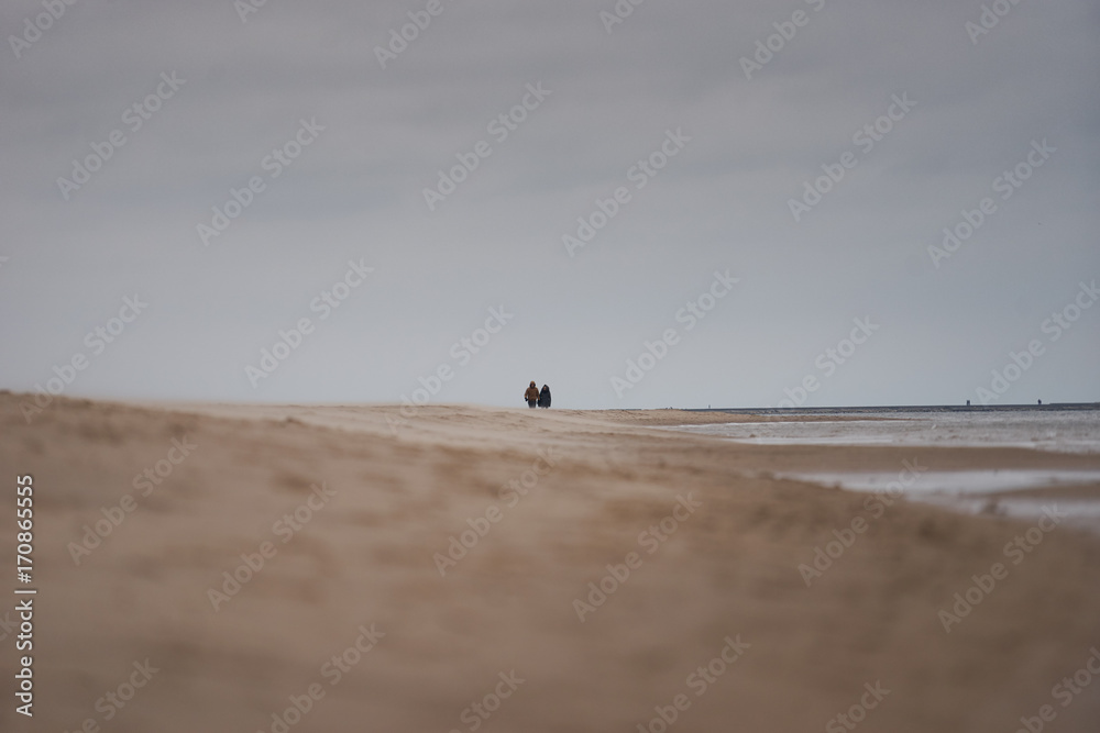 Windy coastline with couples