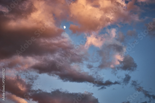 Evening sky with clouds and moon