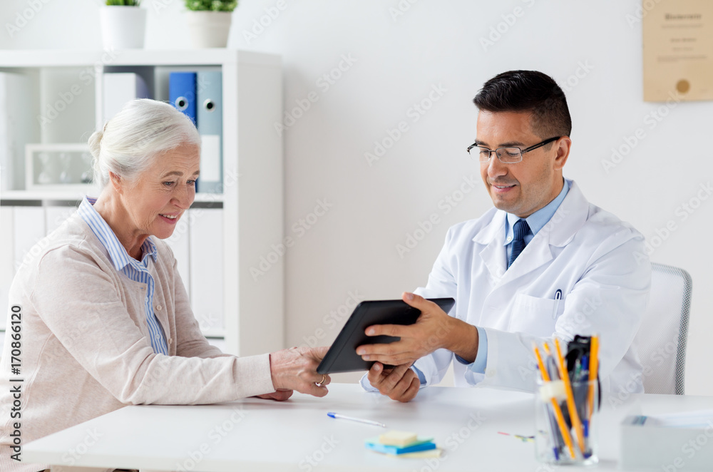 senior woman and doctor with tablet pc at hospital senior woman and doctor with tablet pc at hospital