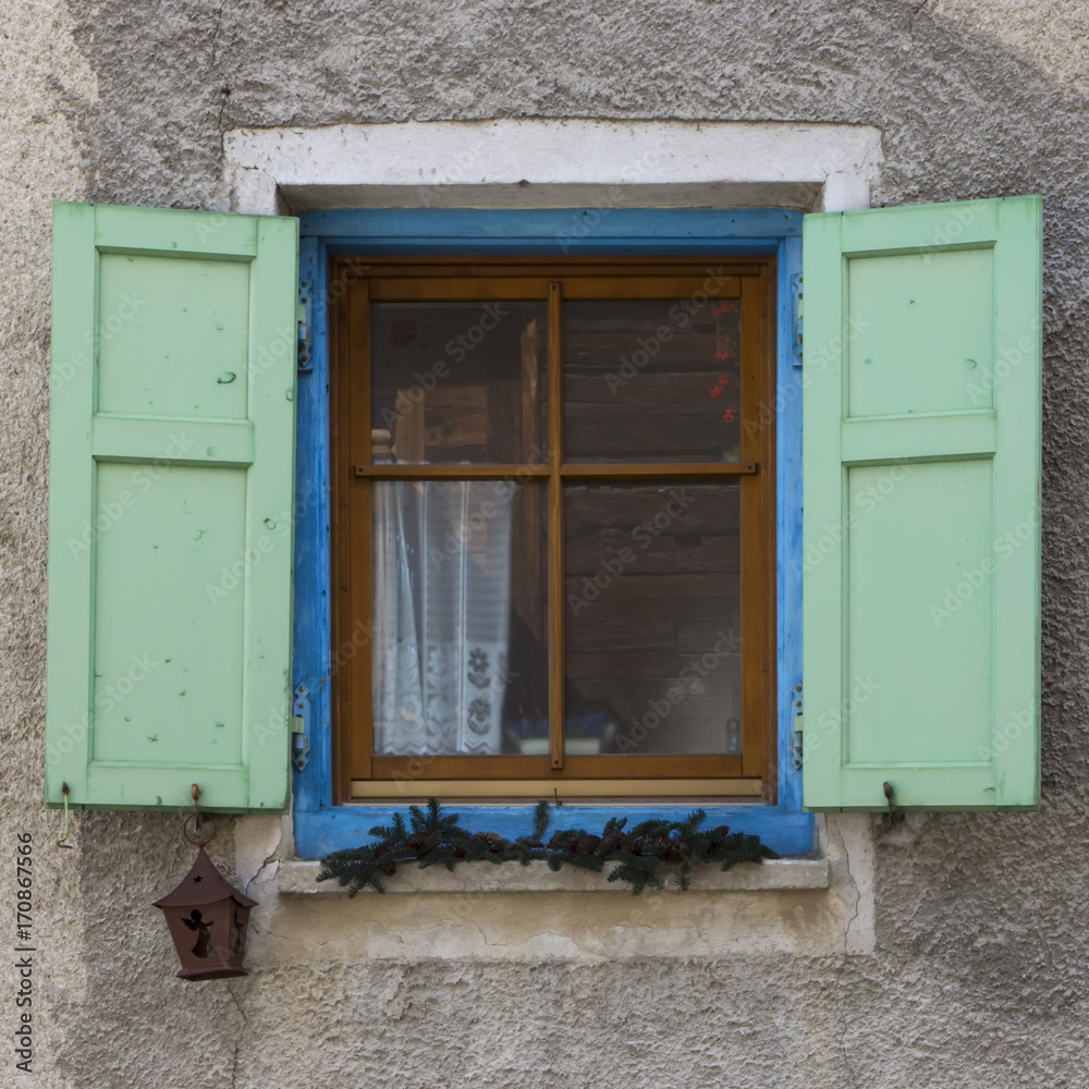 Old window with open shutters Old window with open shutters