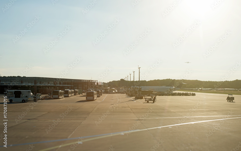 Airport in the morning. Buses and airplanes.