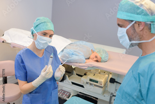 female surgeon anaesthetist at patient operating room photo