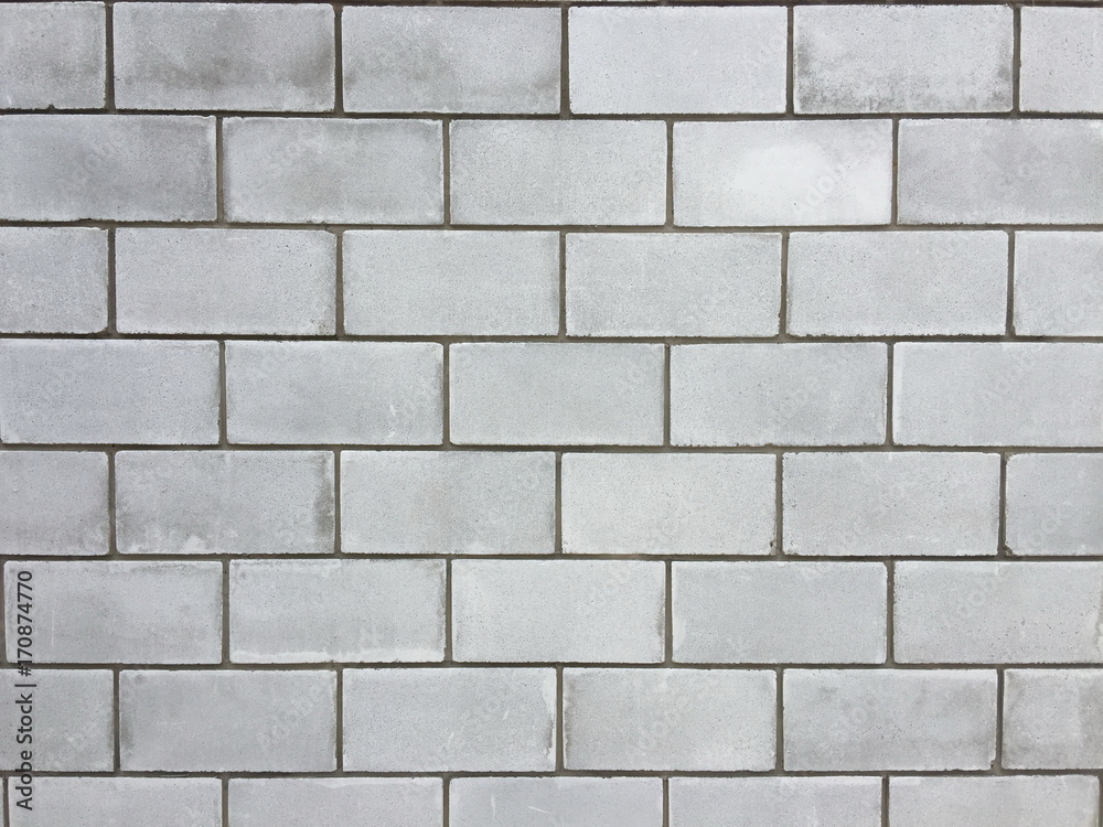 Wall from a large cinder block, a brick wall for a background. Close-up . Wall from a large cinder block, a brick wall for a background. Close-up .
