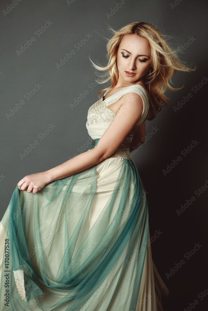 blonde female dancing in gorgeous dress blonde female dancing in gorgeous dress
