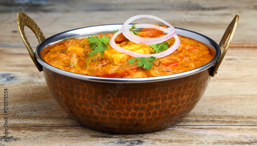Indian Food or Indian Curry in a copper brass serving bowl.