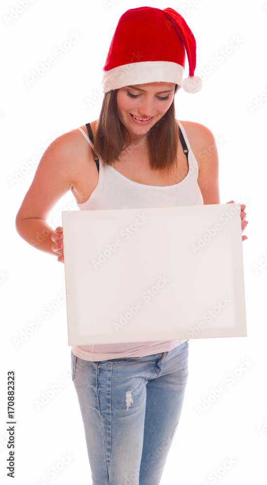 Attraktive Frau mit Nikolausmütze und Schild Attraktive Frau mit Nikolausmütze und Schild