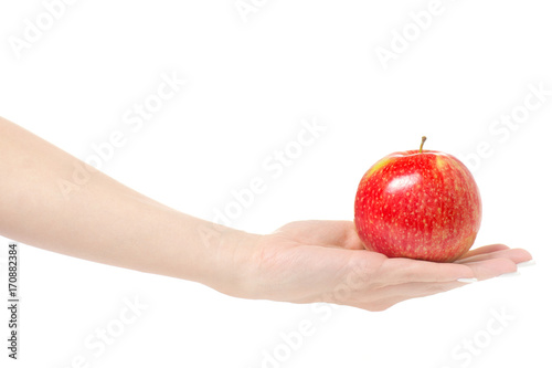 Female hand holding a red apple