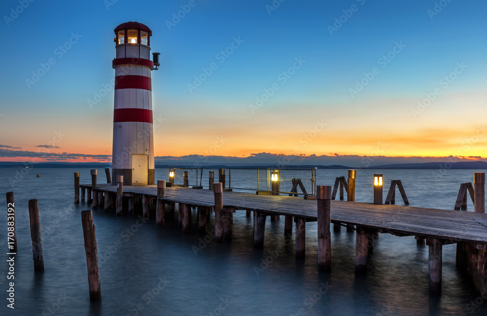 Bright beautiful sea sunset panorama above the beacon tower