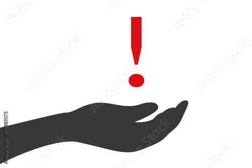 Hand hält Ausrufezeichen