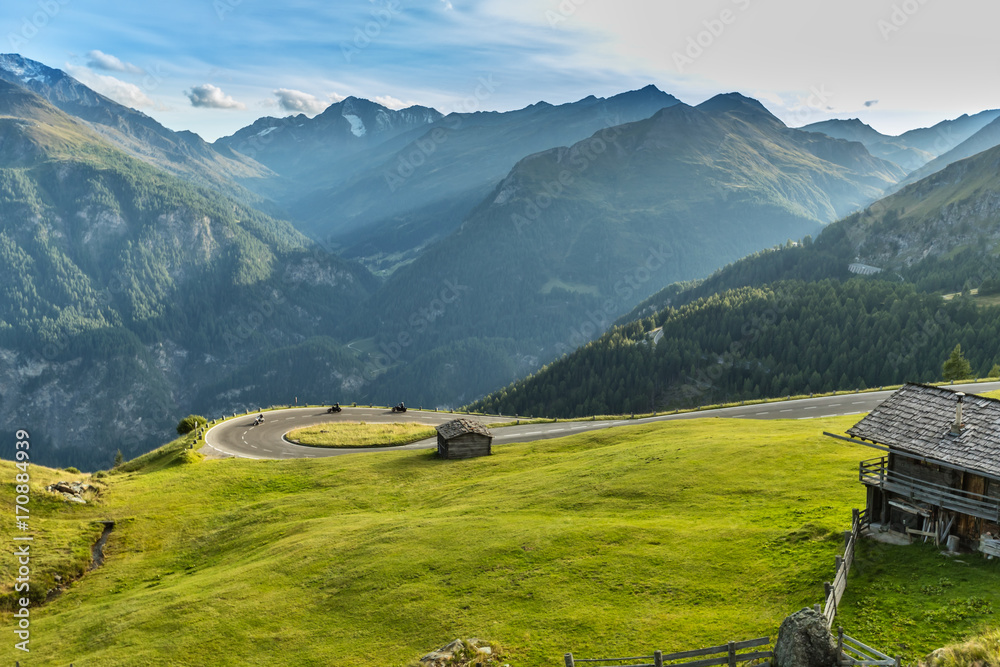 Naklejka premium Motorcycle drivers riding in Alpine highway. Outdoor photography
