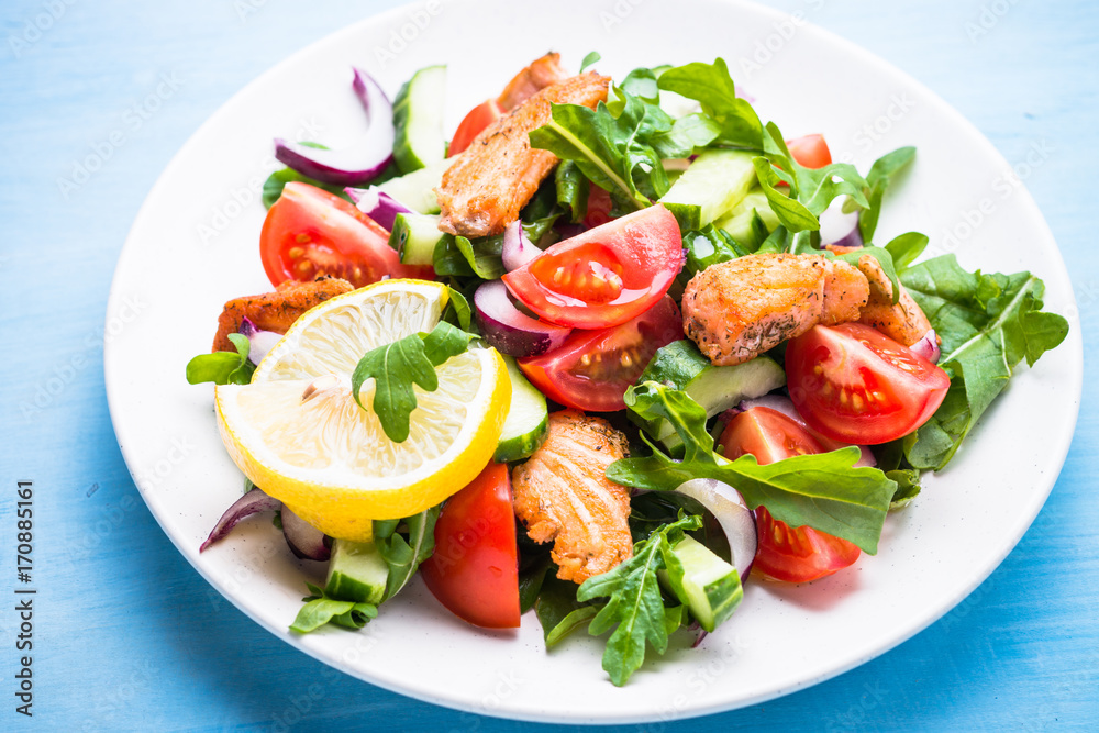 Fresh salad with salmon and vegetables.