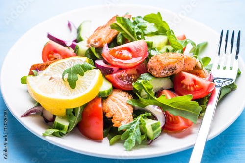 Fresh salad with salmon and vegetables.