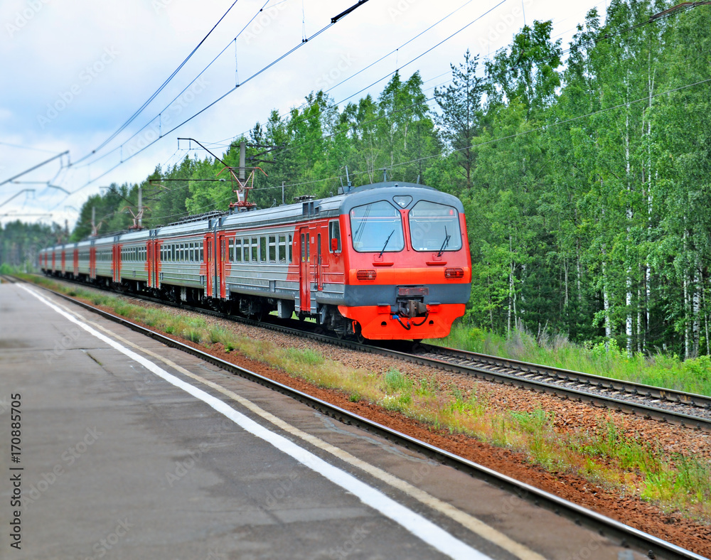 Fototapeta premium Electric train moving past the platform