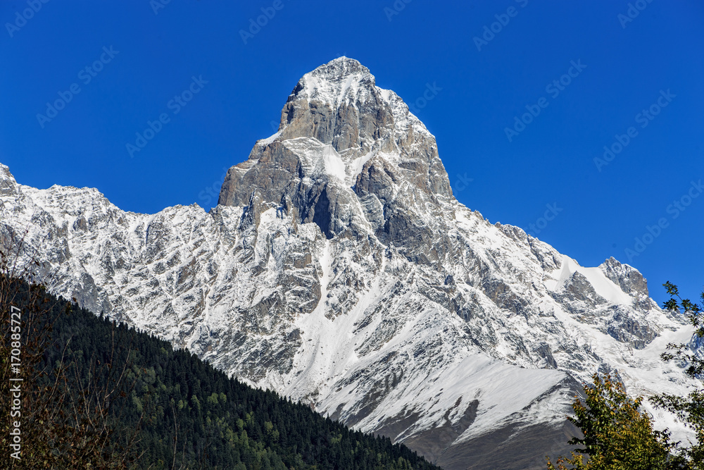 Peak of mount Ushba in Caucasus Mountains, Svanetia region in Georgia